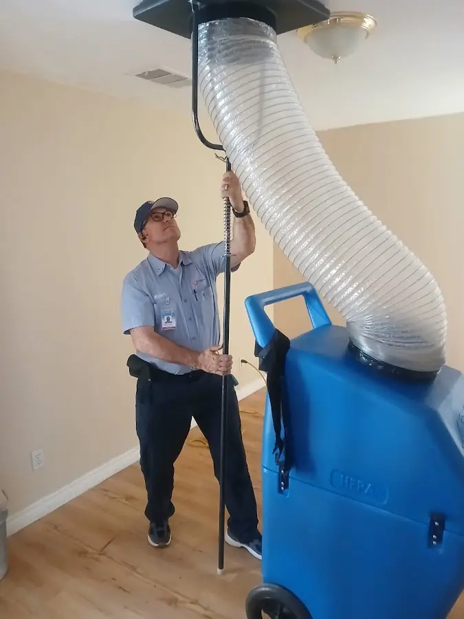 Furnace Tune-Up technician using HEPA equipment in Chesapeake Ranch Estates